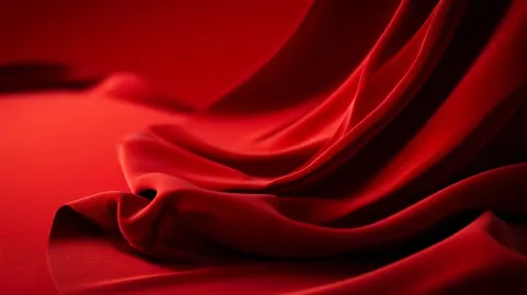 Elegant red velvet surface, high-end, studio lighting, subtle shadows, cinematic luxury feel