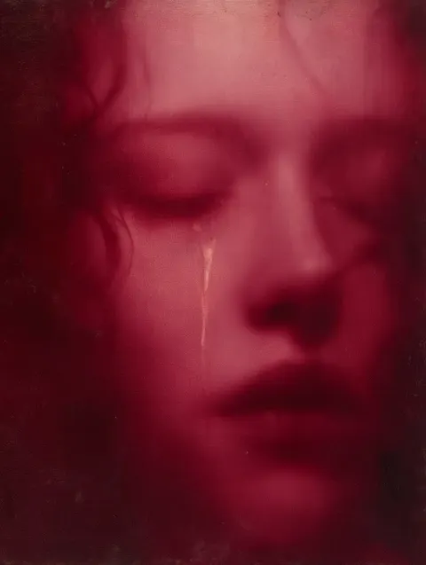 Draw blurry, ethereal close-up woman's face with closed eyes, a single tear tracing her cheek