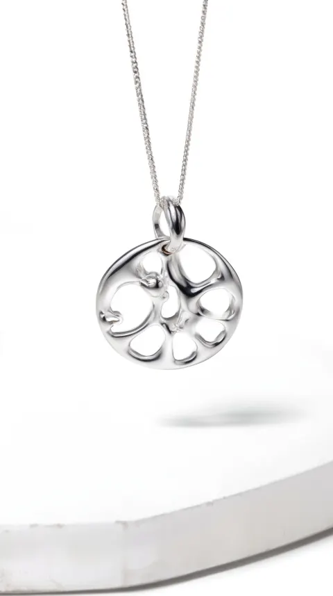 A silver pendant with an abstract pattern, designed in the style of gentle monster brand