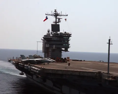 Two a f14 tomcat fighter jets, full ship side view zoomed out