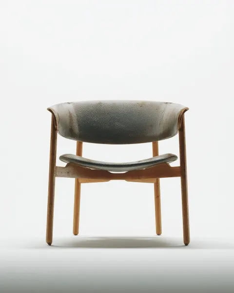 Minimalist armchair, wooden cilindric structure, esbelt design, elegant shapes