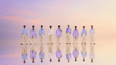 Dreamy high-key fashion editorial group photo: nine slender young men, full-body