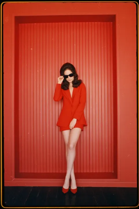 Vintage color photo, full-body portrait, realistic fashion photography with soft focus