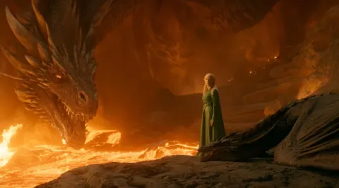 Movie still of an epic battle scene between the most powerful dragon in history and gwyn