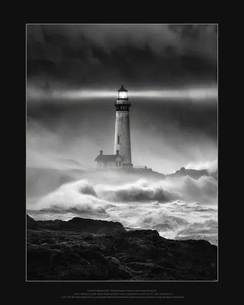 "TALL vertical black-and-white photograph of a lighthouse standing against a violent ocean storm. Wa