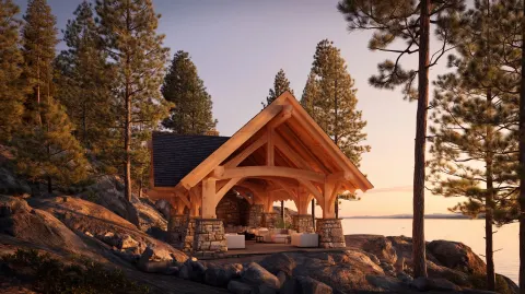 Architectural photography of a luxurious heavy timber frame cabana built on a rocky lakeshore