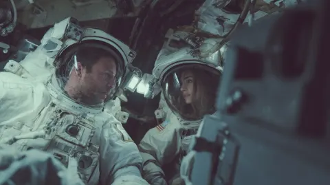 2 astronauts in a ship, a man and a woman, hyper realistic, cinematic