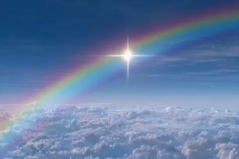 A photorealistic studio quality color image of a brilliant light blue sky with a colorful arching ra