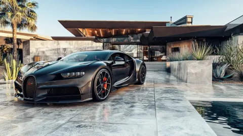 High-end architectural visualization: black carbon Bugatti Chiron parked in front of a multi-million