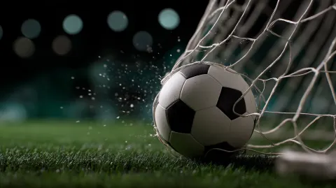An soccer ball puck hitting the back of the net as it scores a goal