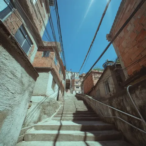 Ultra-high-definition wide-angle street-level view of a Rio de Janeiro favela under intense midday s