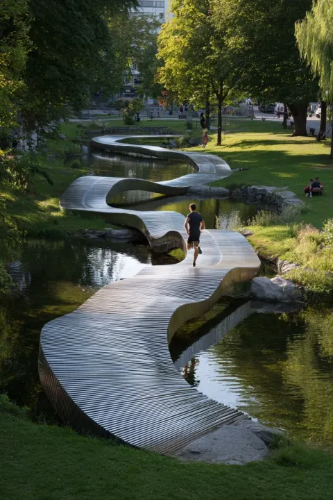 Parametric sculptural running track made of stainless strip line in a park