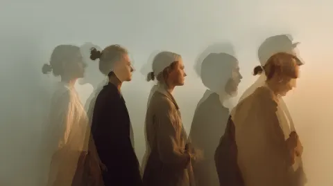 Overlapping silhouettes of the same person at different ages, soft transitions