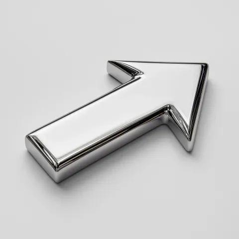 Photograph of a shiny, single sided chrome arrow on white background, 3/4 view