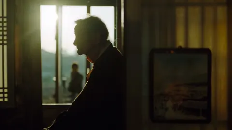 A poetic, cinematic backlighting photograph in a Traditional Korean home. An incredibly elderly Kore