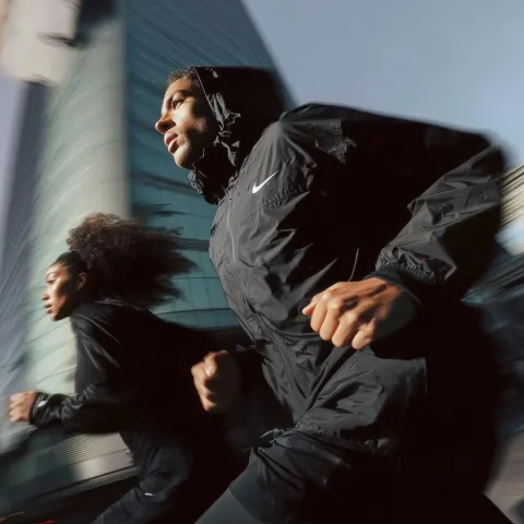 Urban running editorial, cinematic street photography, natural light, slight motion blur