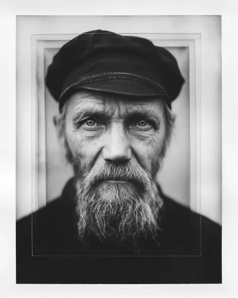 Black and white multi-layer photo collage portrait, stacked photographic prints physically placed ov