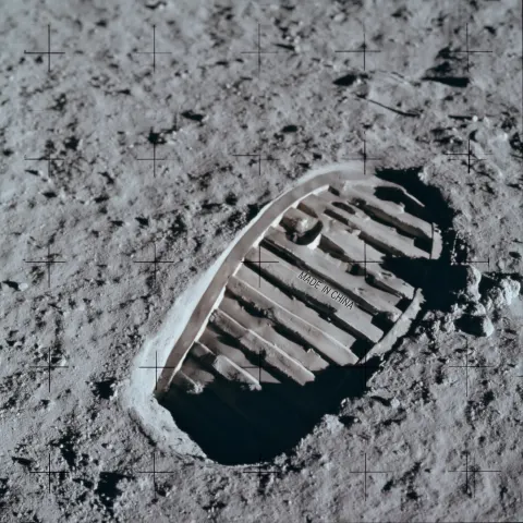 Close up shot iconic first moon foot print in the moon surface boot to bottom left NASA photo fine b