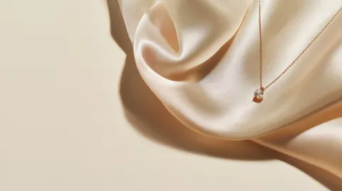 Elegant feminine jewelry scene, soft beige and cream palette