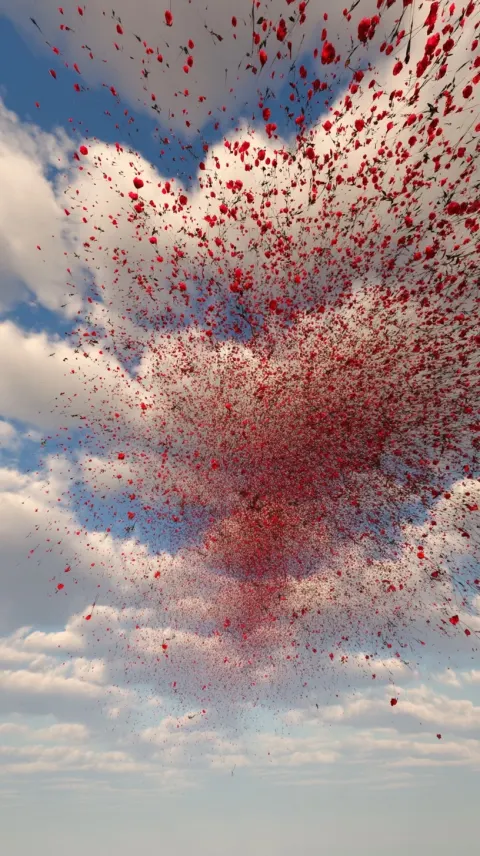 A sky full of tiny red flowers is falling, looking like volcanic ash. Realistic 3D effect.