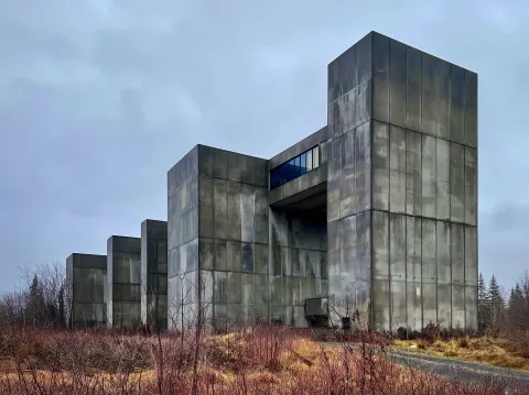 Exterior concrete brutalist unmarked government building. very close to the building. color photo wi