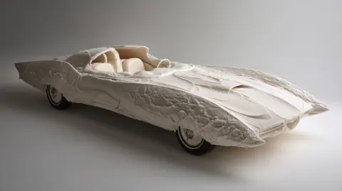 Retro-futuristic coupe with smooth aerodynamic body