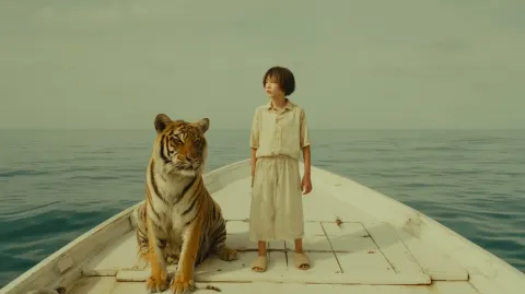 The protagonist standing on top of his small white boat