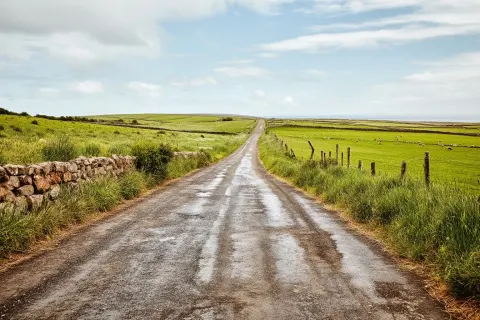 The road from Ireland, roadside perspective with foreground texture of worn pavement